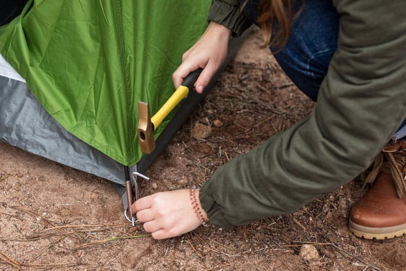 using a hammer for heavy duty tent stakes