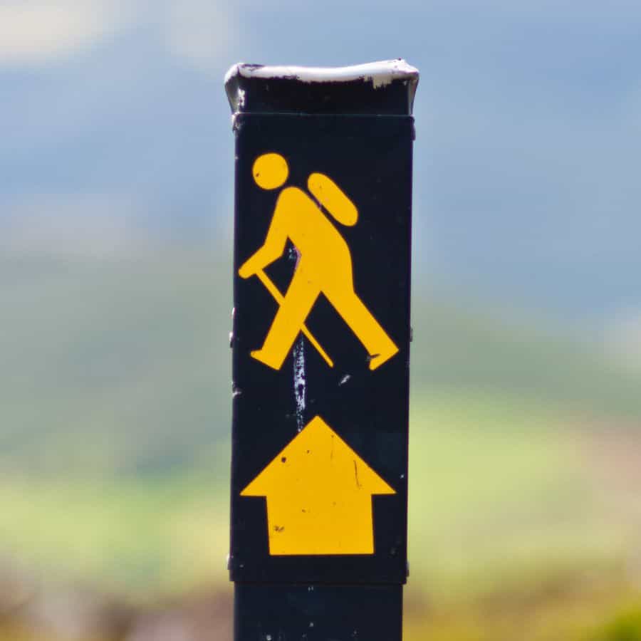 long distance hiking signpost for hiking boots