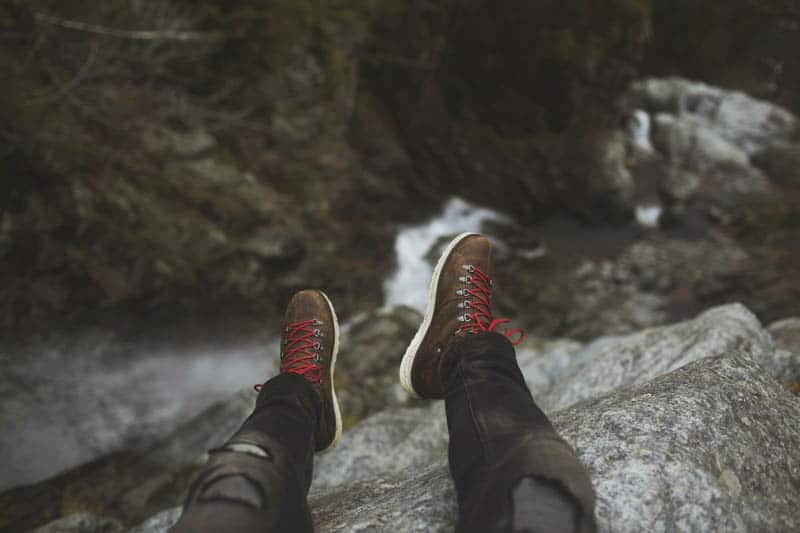 brown leather boots with red laces for hiking