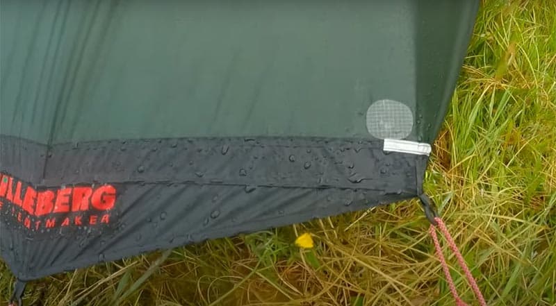 repairing a tent with a patch kit