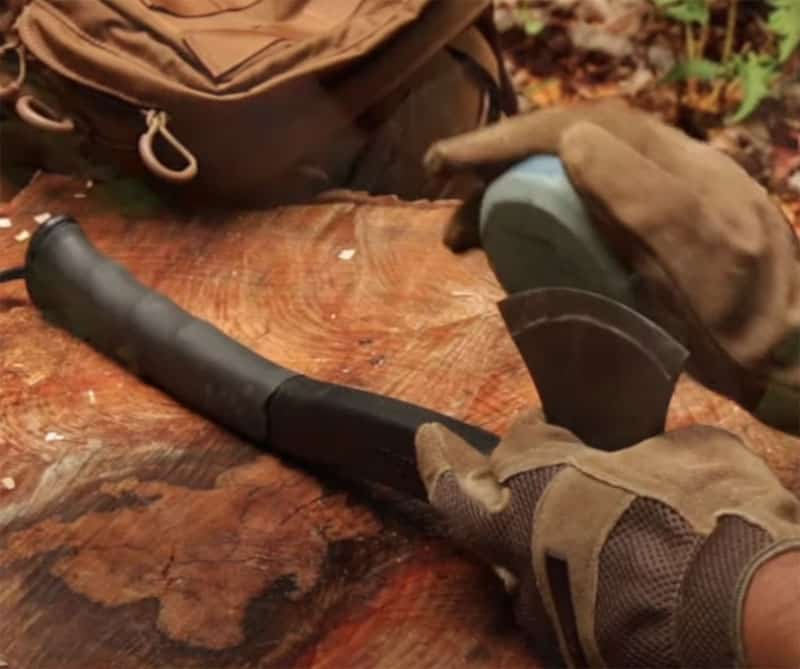 sharpening a bushcraft hatchet with a stone